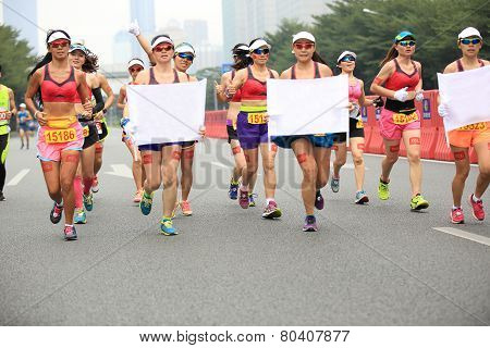 Unidentified marathon runners on the street