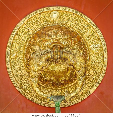 Beauriful golden door handle at Namdroling Monastery (Golden Temple), Bylakuppe, Karnataka, India