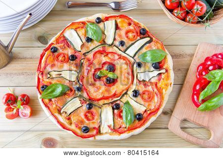 Italian Pizza With Black Olives, Cherry Tomatoes, Eggplants And Peppers