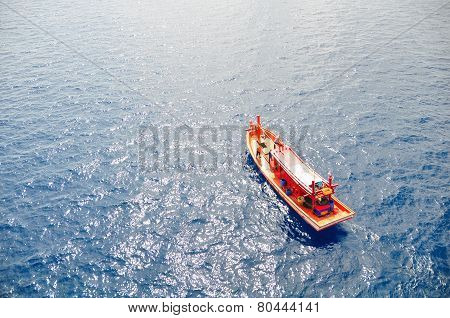 Fishing boat heading out to the gulf in the early morning