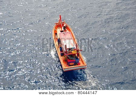 Fishing boat heading out to the gulf in the early morning