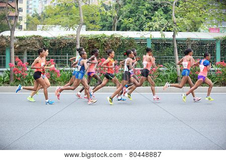 fitness marathon runners running on road