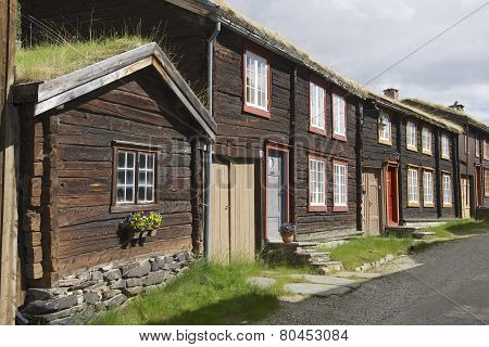 Traditional houses and church bell tower exterior of the copper mines town of Roros Norway.