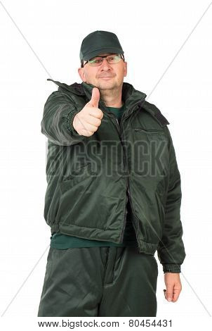 Worker in winter workwear with thumb up.