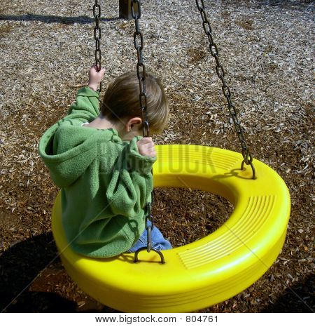 boy on tire swing