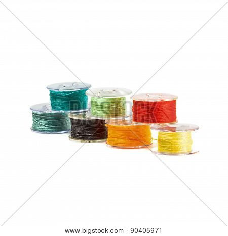 Plastic spools of threads.
