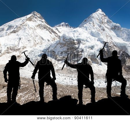 Silhouette Of Men With Ice Axe In Hand, Mount Everest