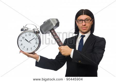 Handsome businessman holding hammer and alarm clock isolated on white
