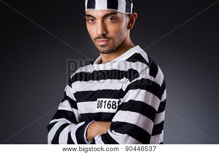 Angry prison inmate in dark room