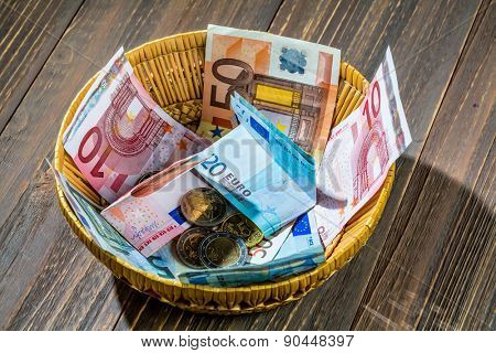 a basket with money for donations and gratuities