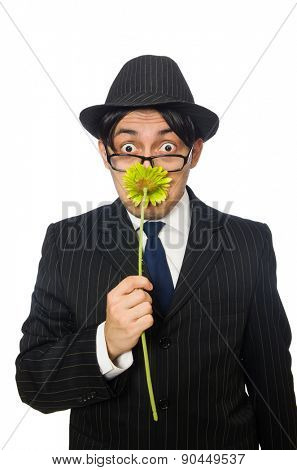 Young man in black costume with flower isolated on white