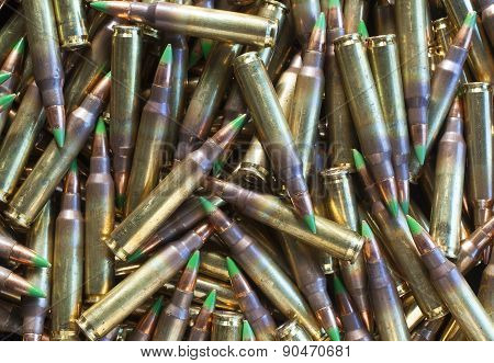 Pile Of Ammo With Green Tipped Bullets