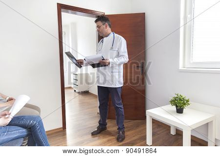 Doctor Is Reviwing An X-ray With Patients