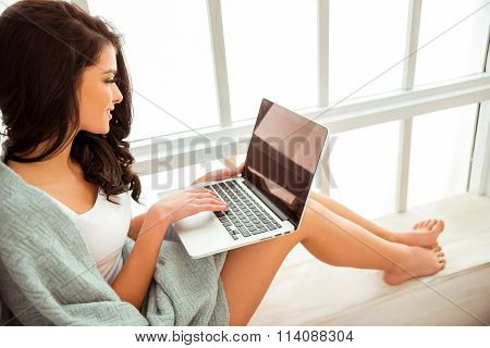 Beautiful Girl On A Window Sill