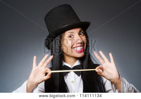 Woman magician in funny concept