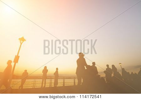 Sunset scenery with silhouette of people walk at Tamsui old street at Tamsui, New Taipei City, Taiwan.
