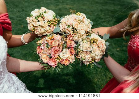 Bride In Wedding Dress And Bridesmaids Red Dressing Holding Wedding Bouquets On Ceremony