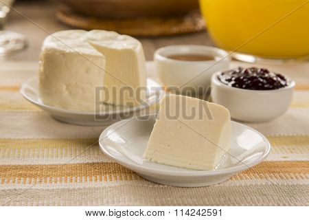 Brazilian Sheep Cheese. Fruits And Different Types Of Cheese In The Background.