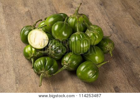 Some Green African Eggplants Over A Wooden Surface