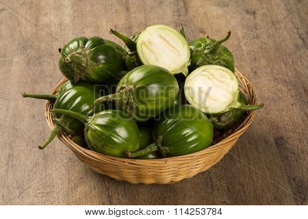 Some Green African Eggplants Over A Wooden Surface