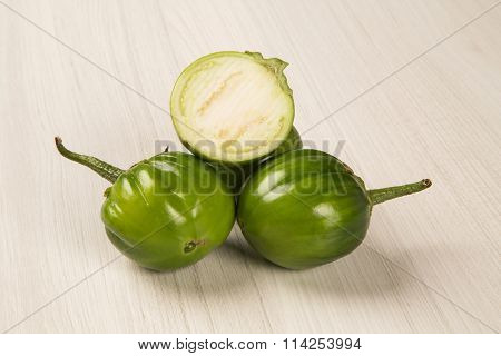 Some Green African Eggplants Over A White Background