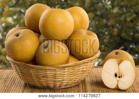 Some Asian Pears Over A Wooden Surface