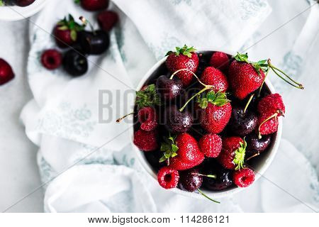 Mix Of Berries On White Rustic Background