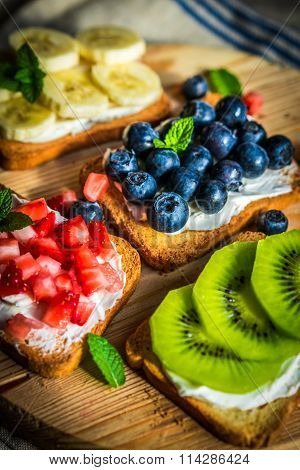 Healthy Sandwiches With Fruits On Wooden Background