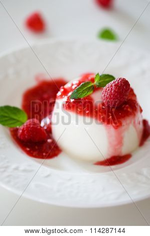 Delicious Italian Dessert Panna Cotta With Raspberry Sauce And Mint On White Background
