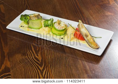 Fish with vegetables. Beautiful layout on a plate