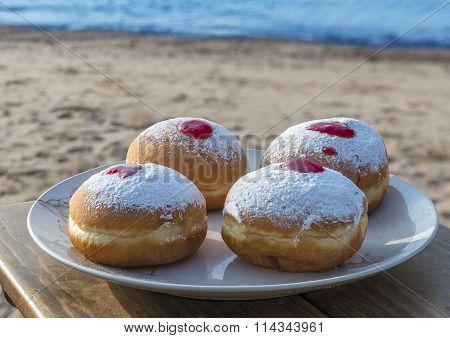 Festive sweet donuts - are traditional Jewish food for Hanukkah holiday