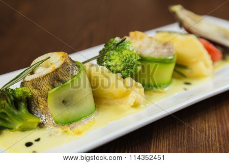 Fish with vegetables. Beautiful layout on a plate