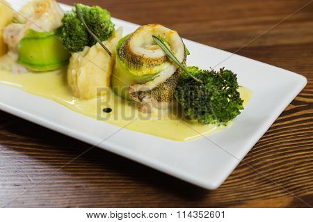 Fish with vegetables. Beautiful layout on a plate