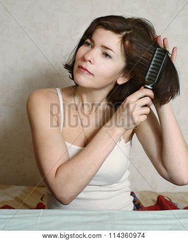 Woman  Try To Comb Hairs