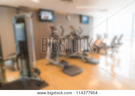 Abstract blur Fitness center with traineger equipments