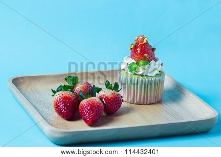 Strawberry Cupcak Topping With Pistachio And Cream,selective Focus
