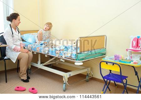 RUSSIA, MOSCOW - AUG 31, 2015: Young girl communicates to health worker hospital ward in multidisciplinary Clinic Center Endosurgery and Lithotripsy (CELT) (woman with release)