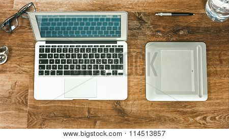 Laptop On Vintage Wooden Desktop