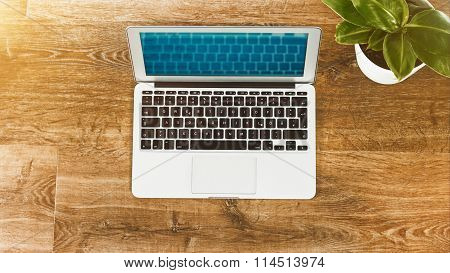 Laptop On Vintage Wooden Desktop