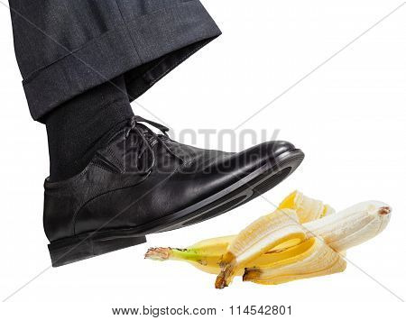 Foot In The Right Black Shoe Slips On Banana Peel