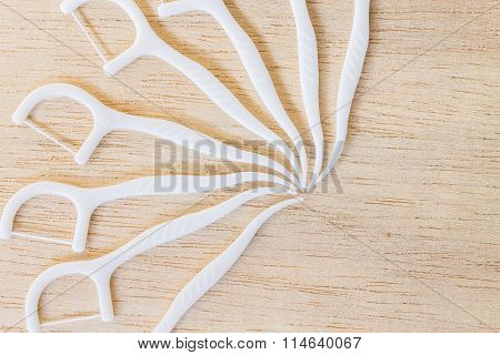 Oral Device : A box of white dental flossers on wooden background