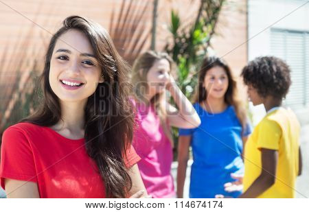 Happy Caucasian Woman With Three Girlfriends In The City