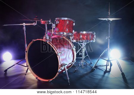Drum set in smoke on a stage