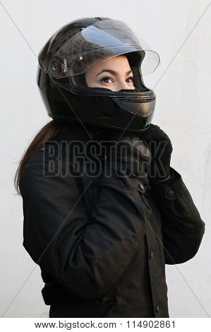 The Motorcyclist Girl  In Black Tie A Helmet