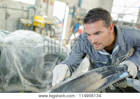 Sanding down a car