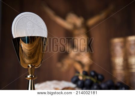 Eucharist symbol of bread and wine, chalice and host, First communion background