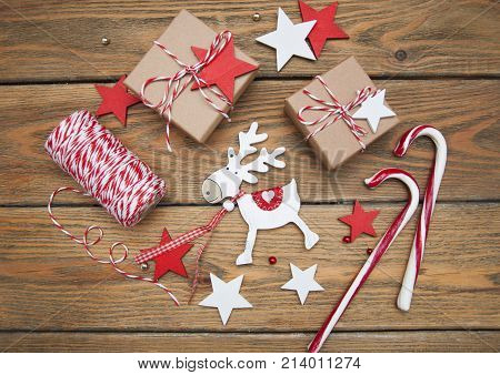 Christmas gift boxes and decorations on wooden background