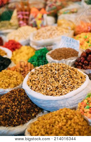 Tbilisi, Georgia. View Of Persian English Common Walnut Juglans Regia , Succade And Dried Fruits In Bags On Showcase Of Local Food Market.