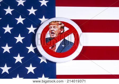 LONDON UK - NOVEMBER 15TH 2017: Anti-Tump badge over an American flag background on 15th November 2017.