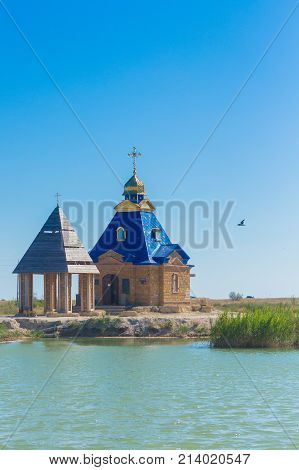 the historical church with lake and blue sky